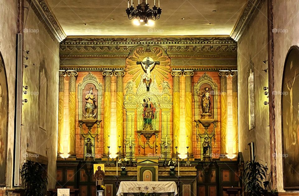 The altar at the chapel of the Santa Barbara Mission. I like this photo because of the light