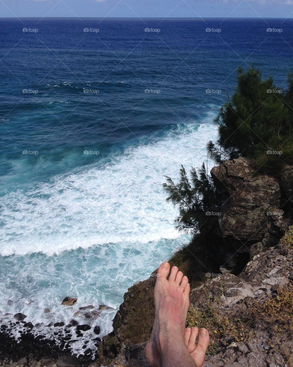 Low section of a person at coastline