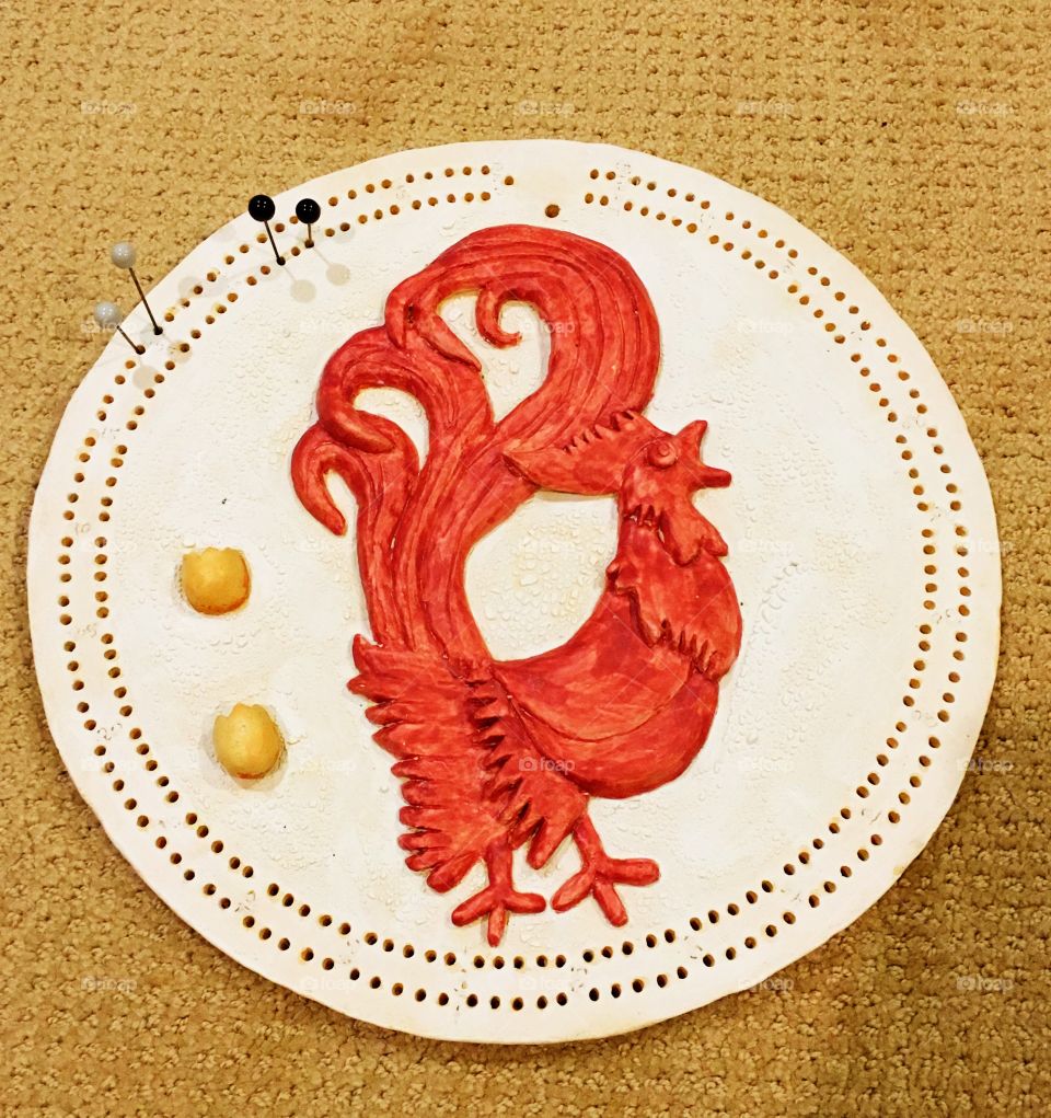 Red rooster, cribbage board