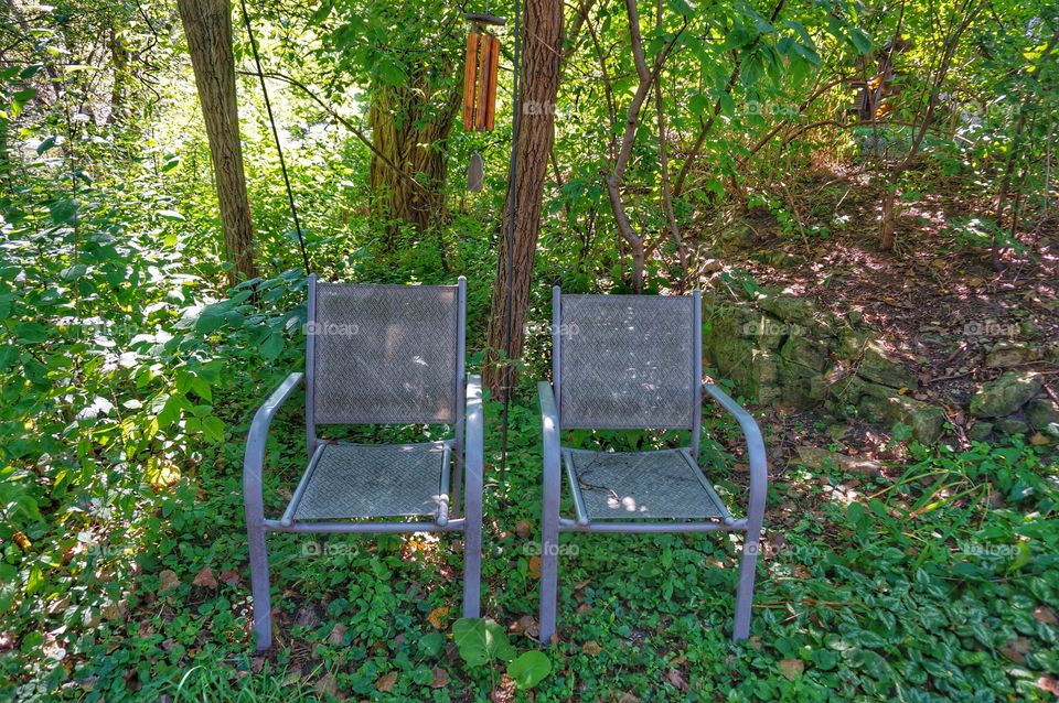 Nature. Two Chairs by River