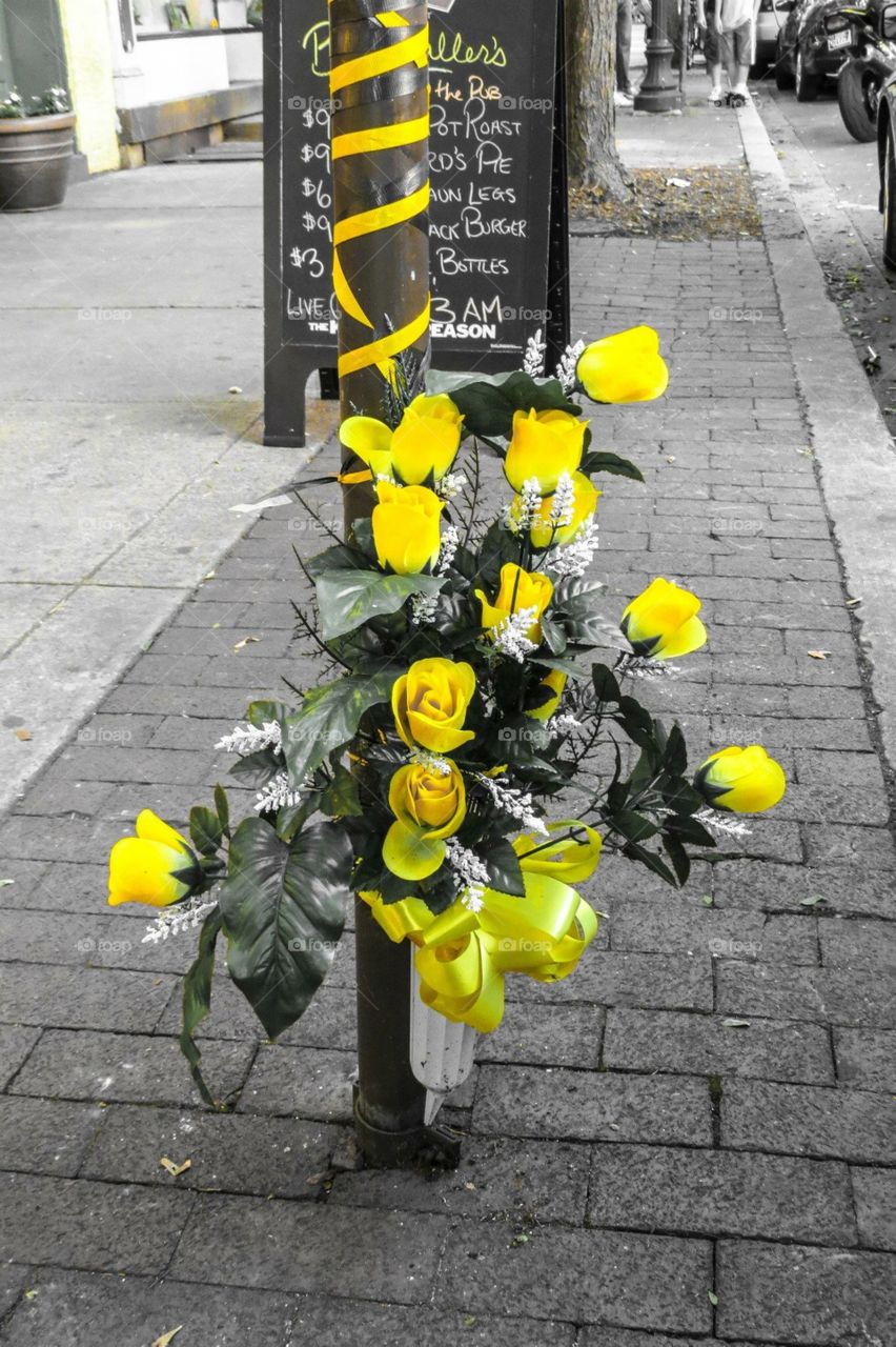 Yellow roses  on a street corner