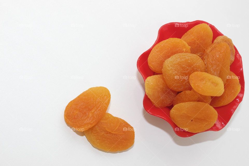 Dried apricots on a white background