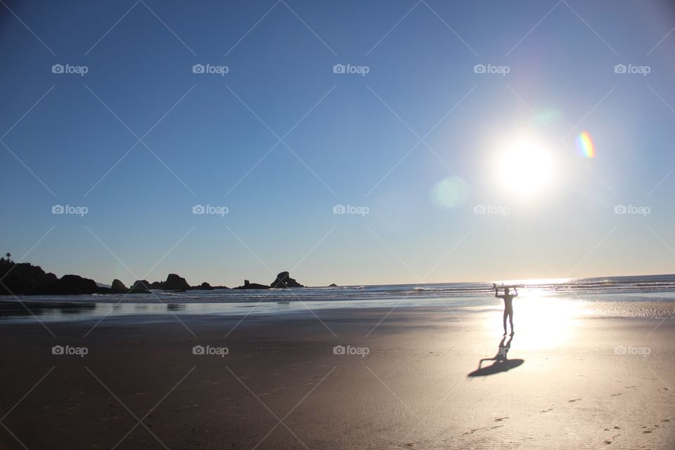 Surfer on the west coast in sun