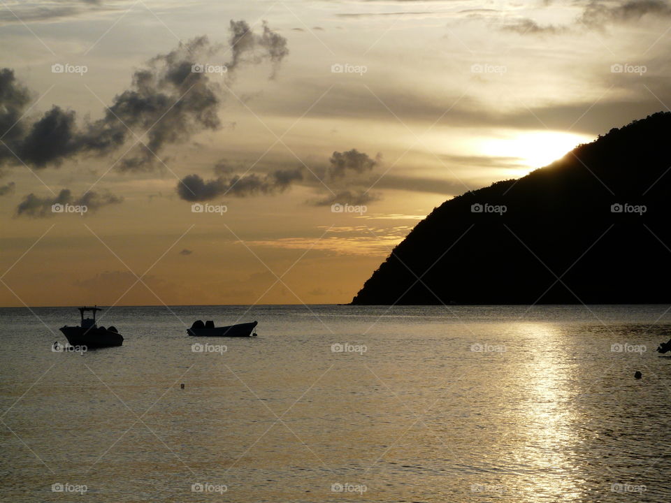 A sailboat at sunset in Martinique