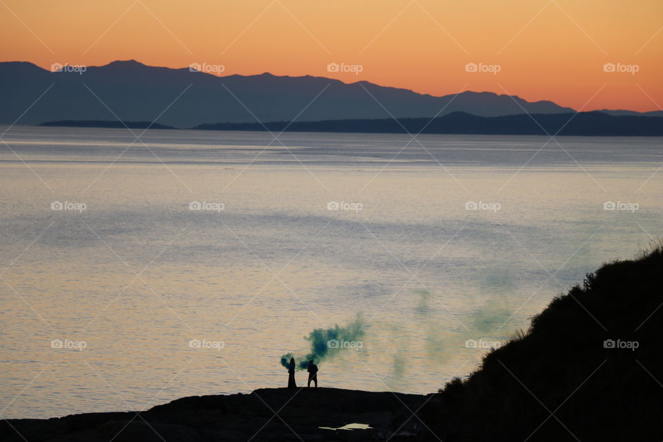 Green smoke  on a beach