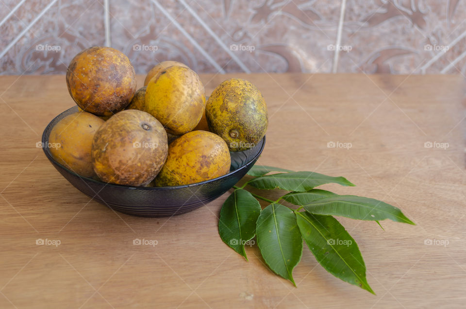 Spondias Dulcis In Blue Dish On Wooden Table