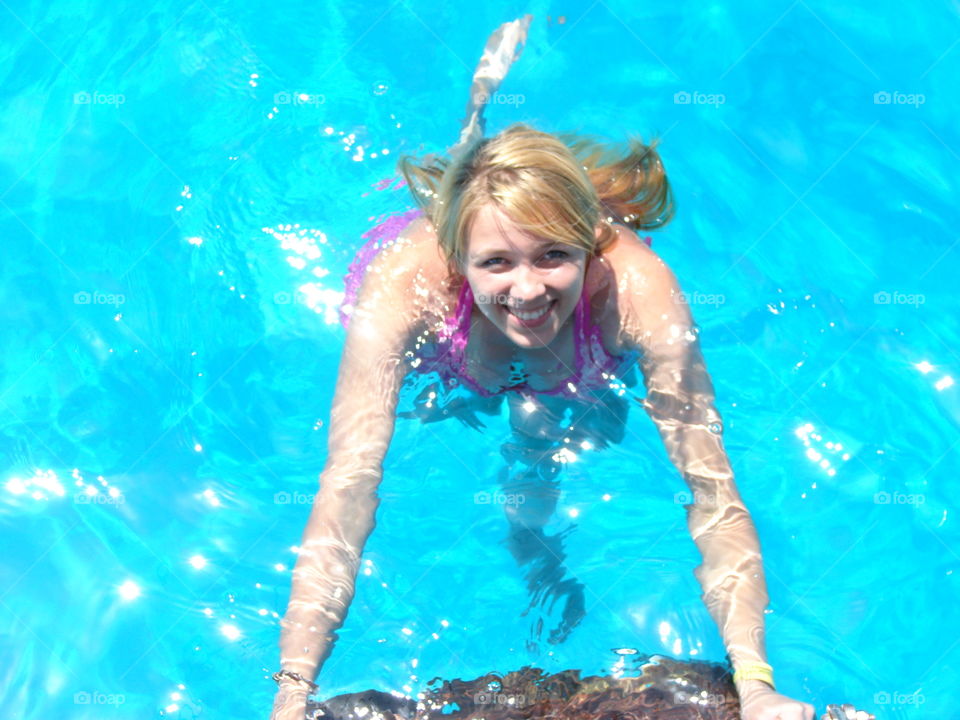 Happy woman in swimming pool