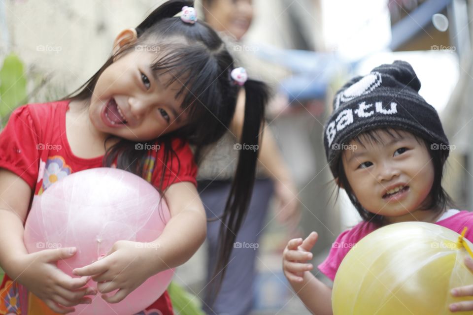 two litte girls play so happy