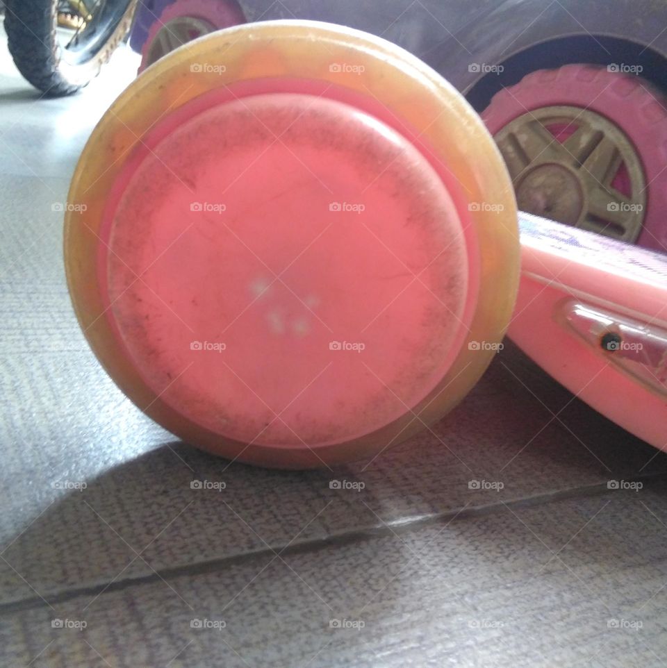 Pink wheel of old scooter toy