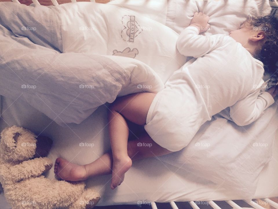 Baby sleeping in bed