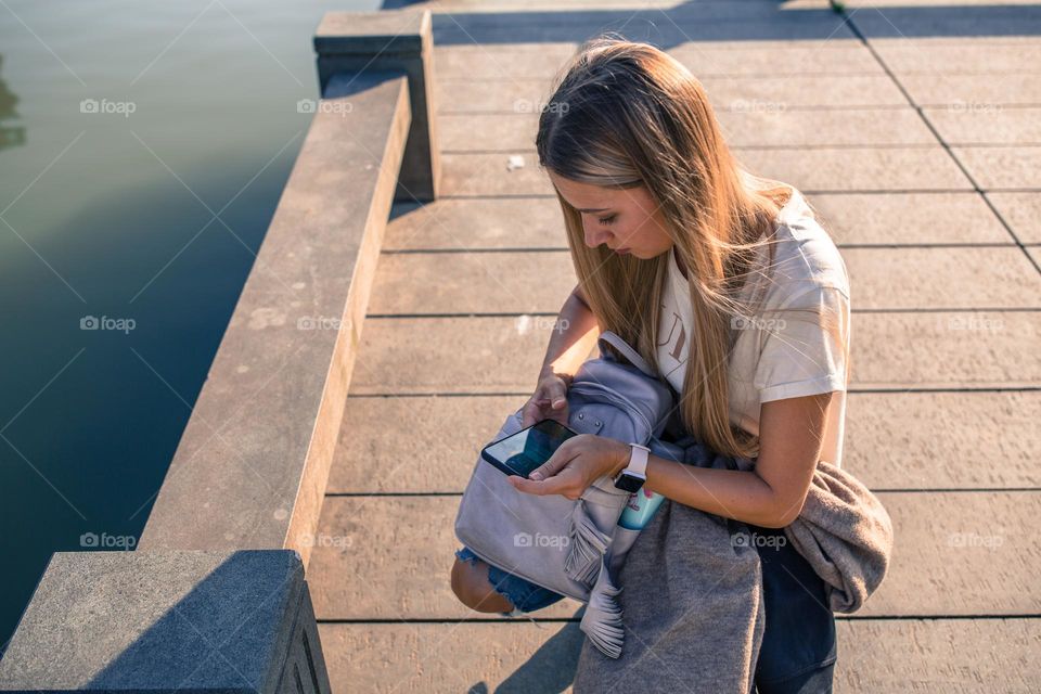 Woman holding mobile phone 