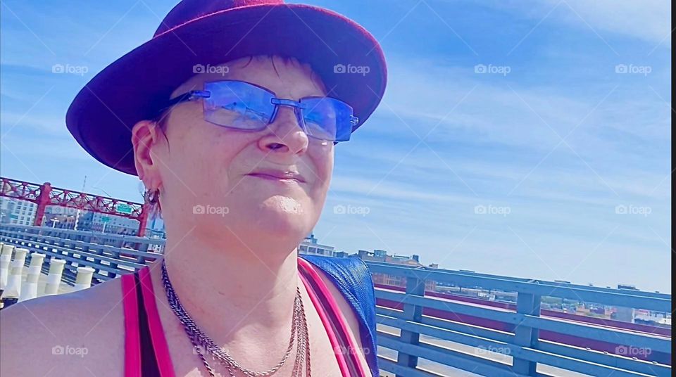 This is me, „Petra Schiller“ a.k.a. „Maxine Firefox“ taking a walk in the brisk summer winds atop the „Pulaski Bridge“ at „Newtown Creek“ towards „Greenpoint“, Brooklyn to go grocery shopping. 2023. Hypnotic Productions
