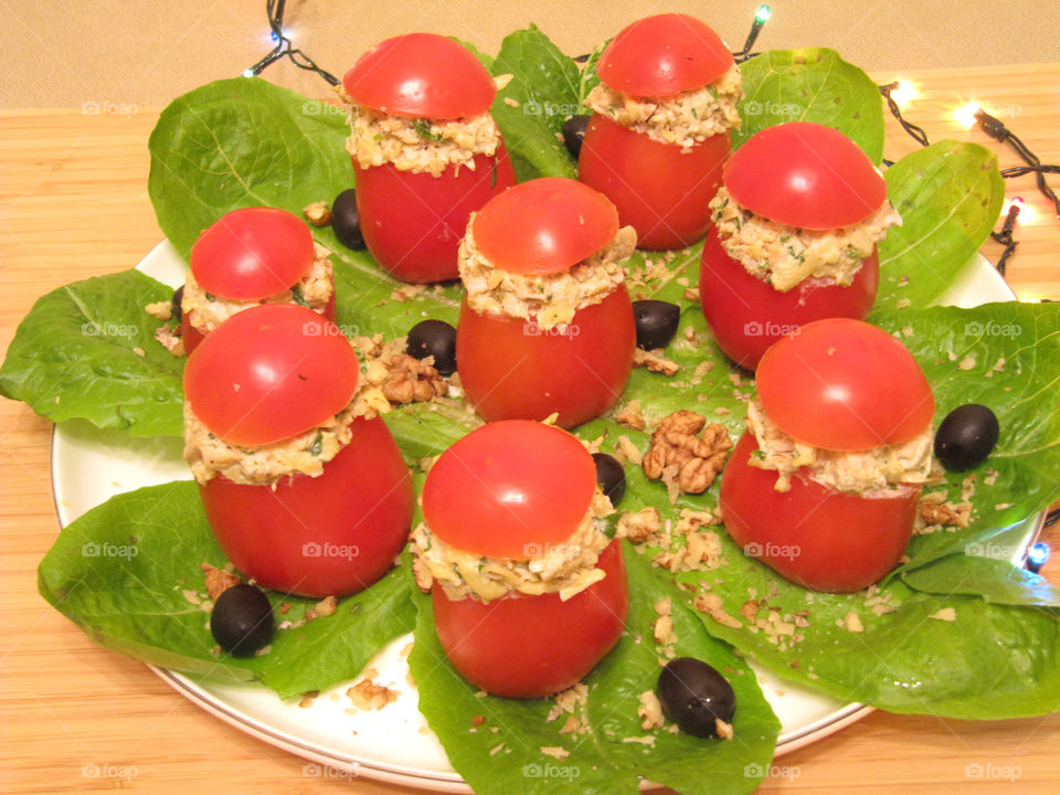 Tasty chicken salad in tomatoes cup