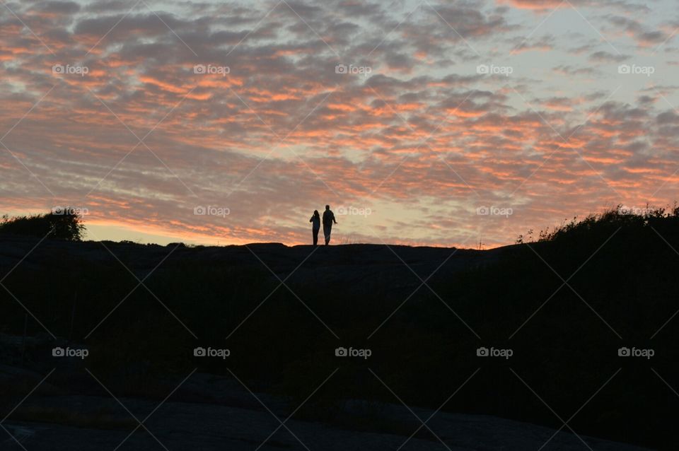 Togetherness.. When I was on my vacation, I look up on the  Mountain, and I see this loving couple in the sunset.