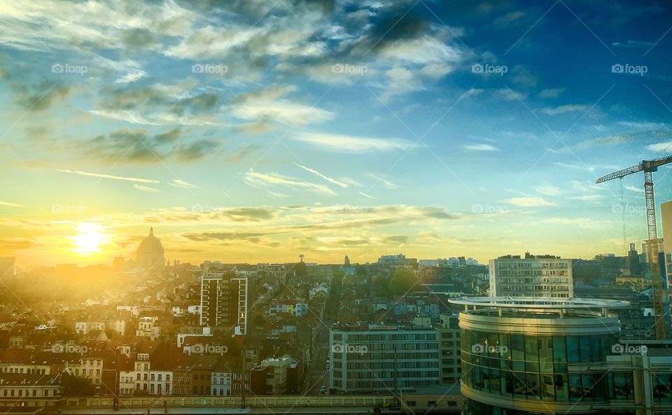 Colorful Golden and blue sky during sunrise over the city of Brussels around the North railway station