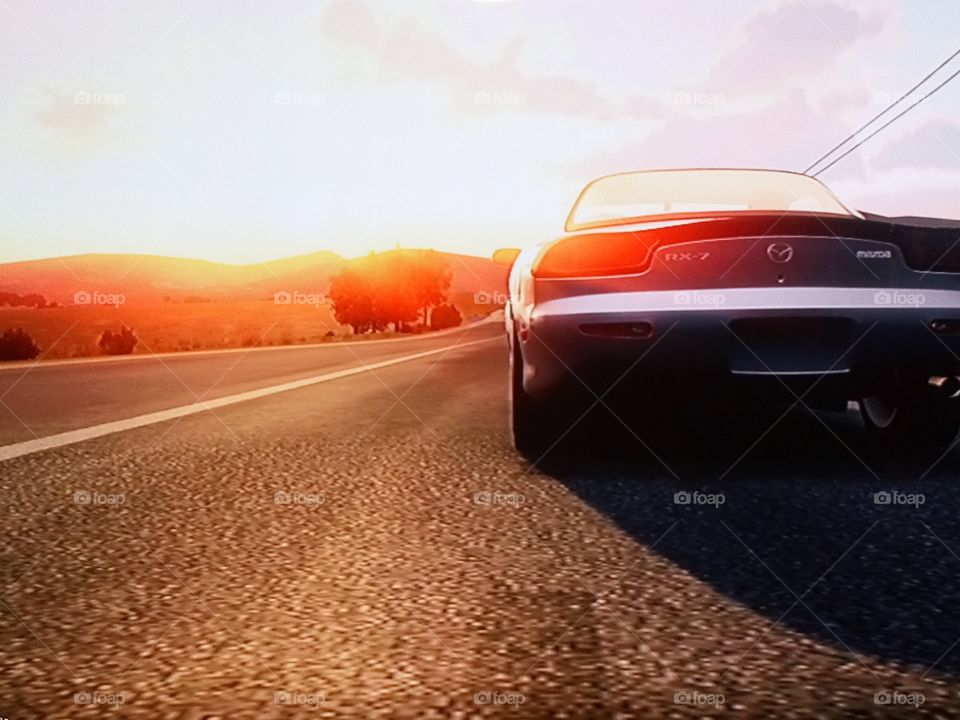 1997 Mazda RX-7 with a sunset on Forza horizon 2