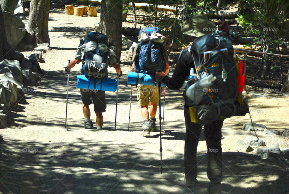 Hikers with heavy duty backpack