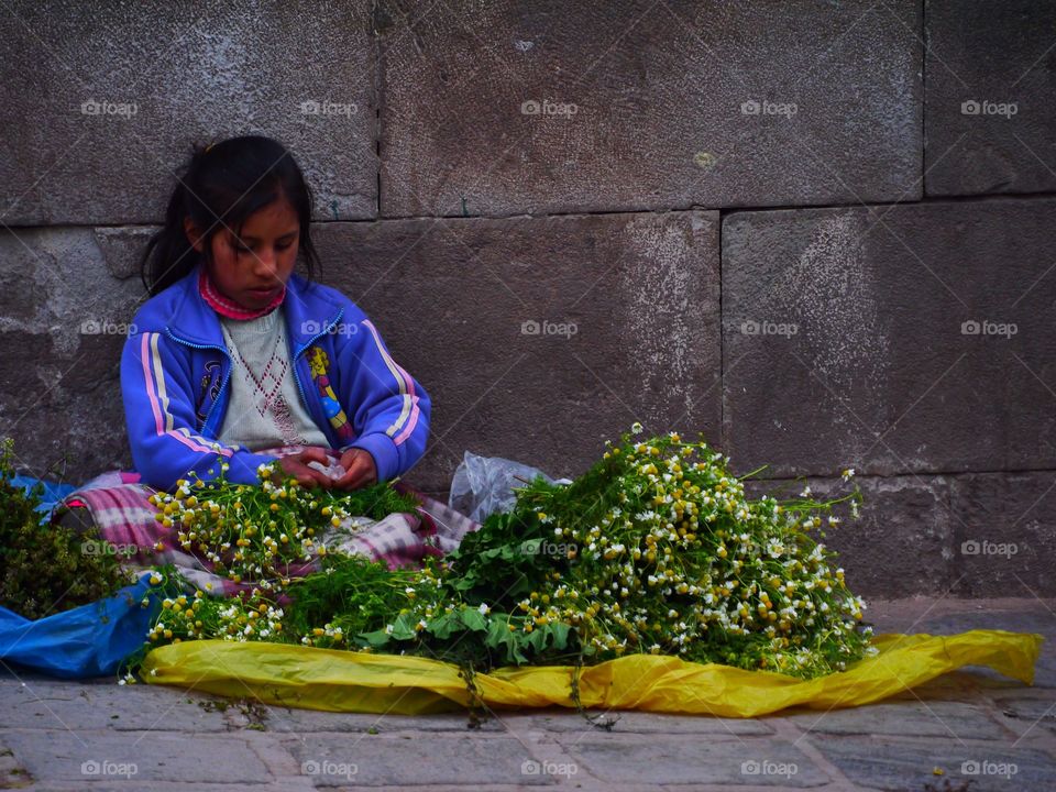 Young flower seller, Cusco, Perù