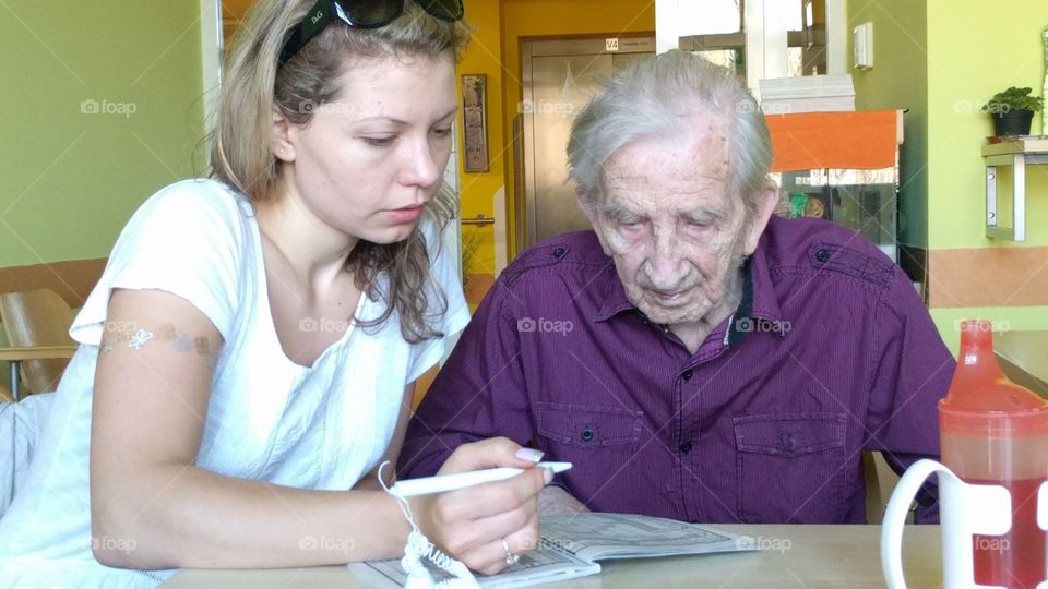 Doing a crossword puzzle with my grandfather who has Alzheimer's