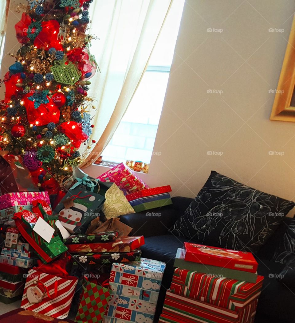 Christmas tree by the window, presents