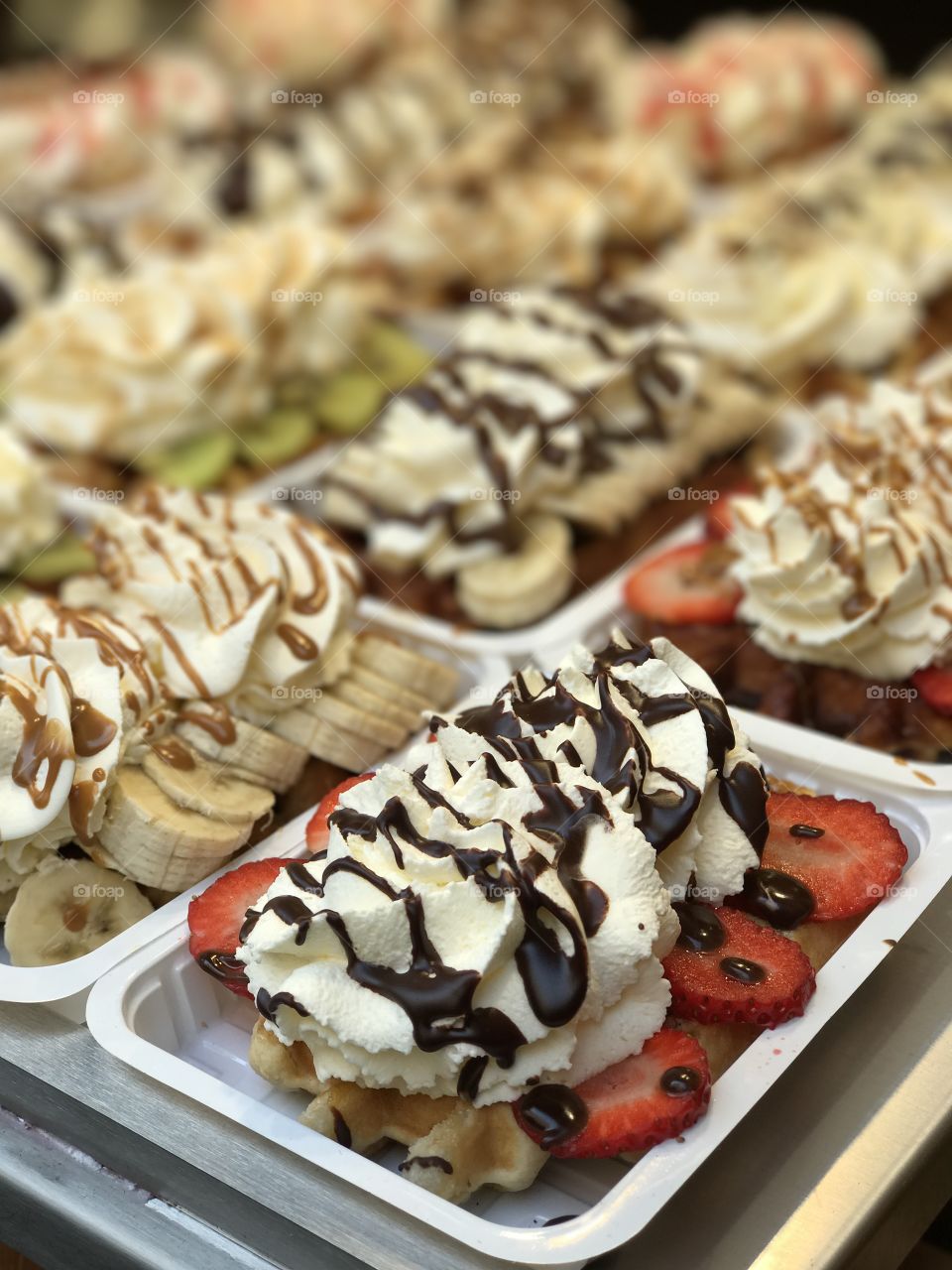 Belgian waffle with strawberries and cream