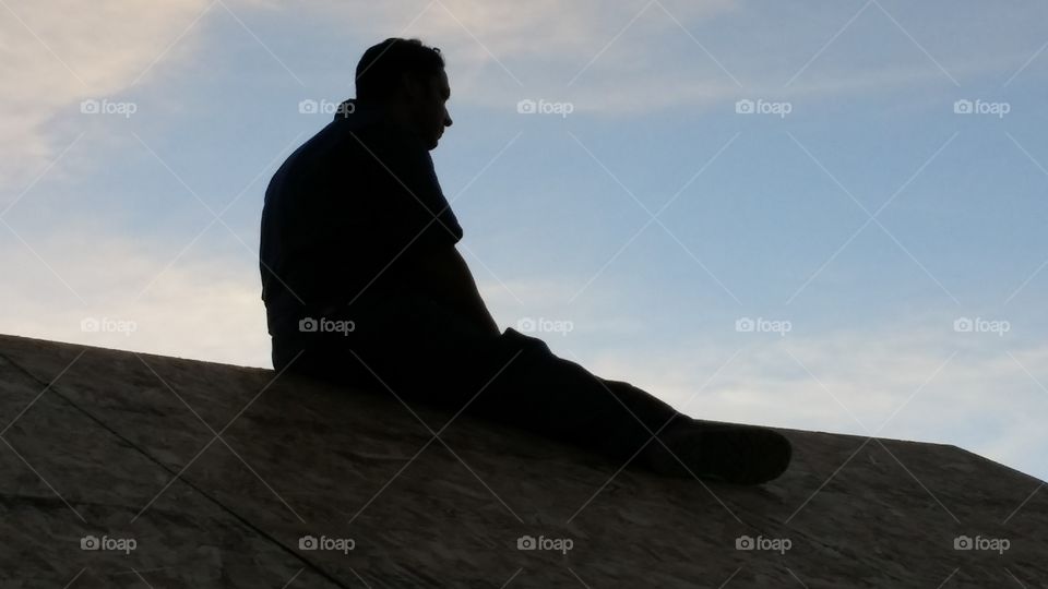 the thinker on a rooftop