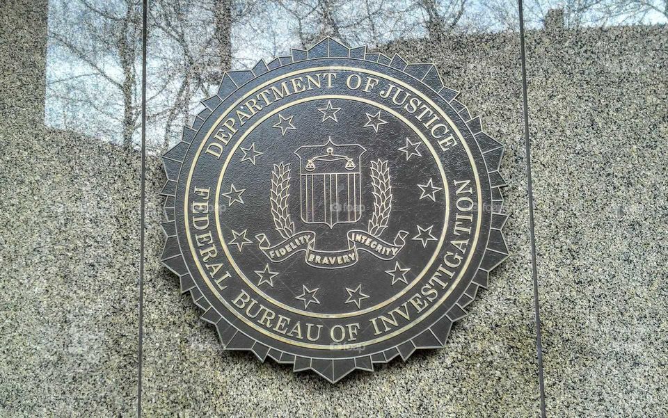 Department of Justice and Federal Bureau Of Investigation Insignia. DOJ and FBI building, Washington DC, USA