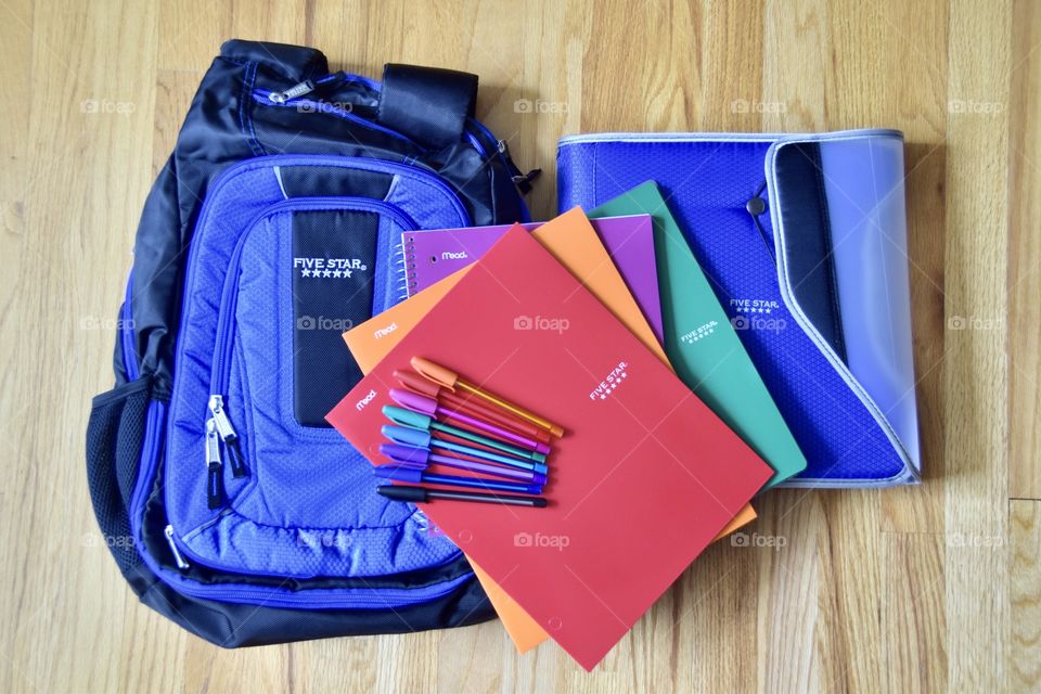 Flat Lay back to school notebooks and knapsack