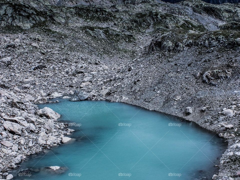 small lake puddle of water in mountainous terrain