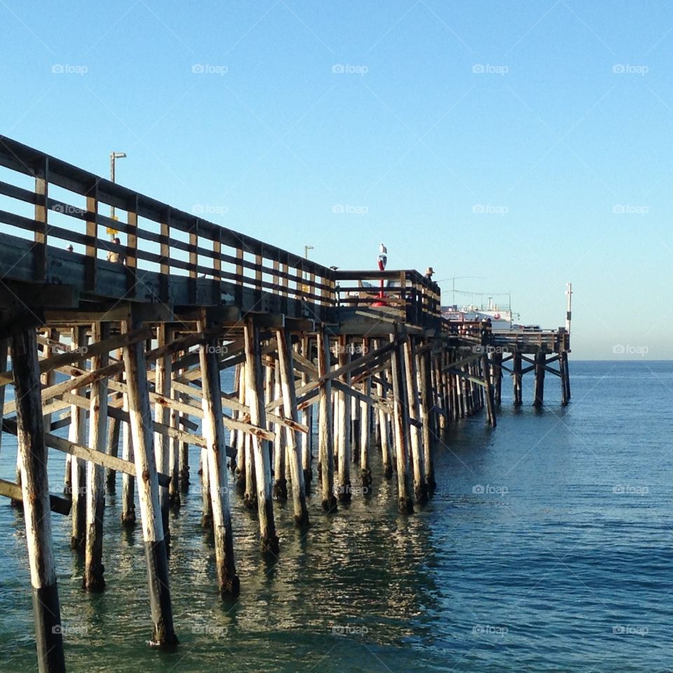 Balboa pier in Newport Beach California in the morning. Sun is rising not many people around. Just peaceful.