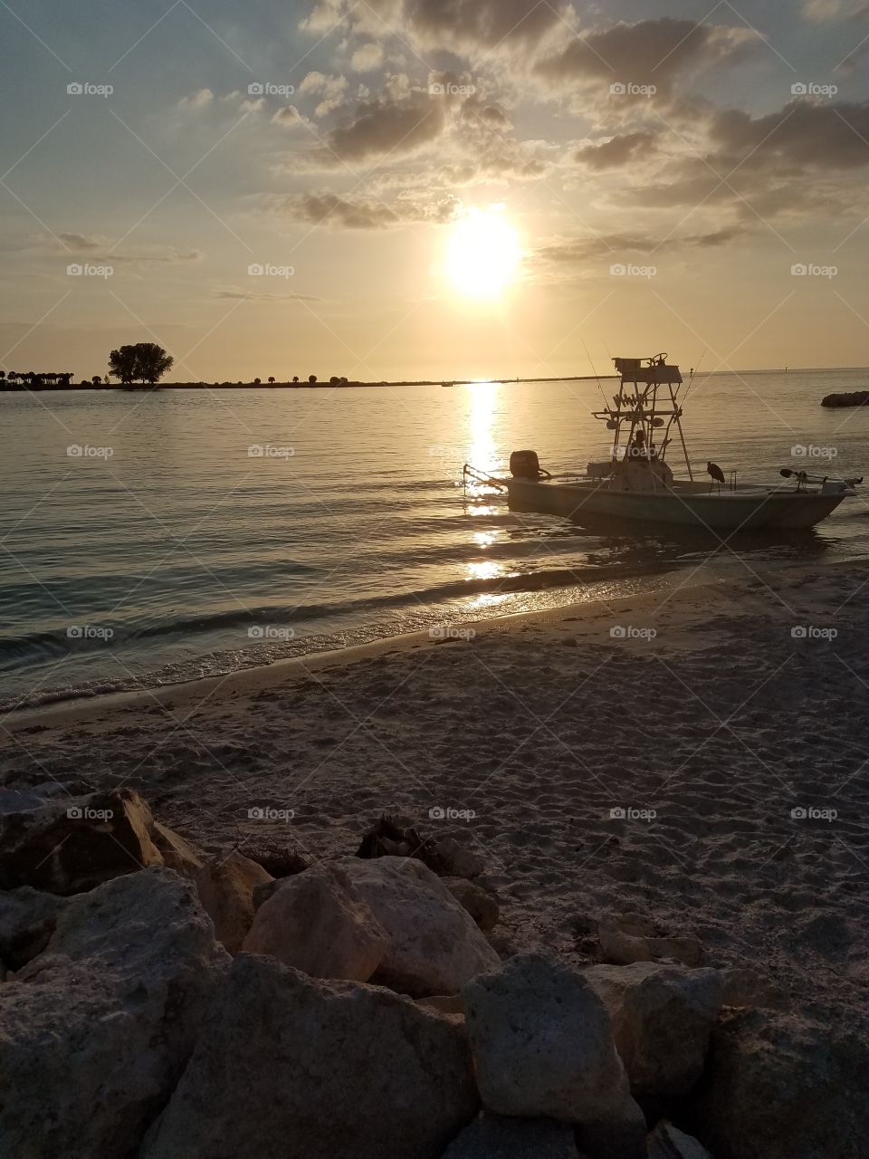 beach sunset with boat