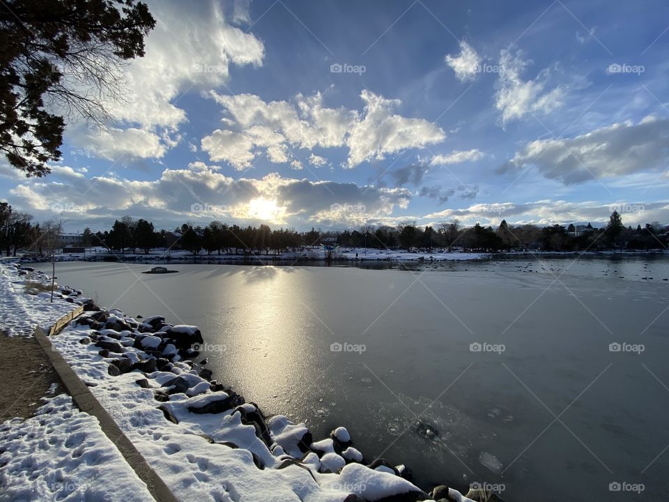 Taking a walk around the lake during a winter wonderland. 