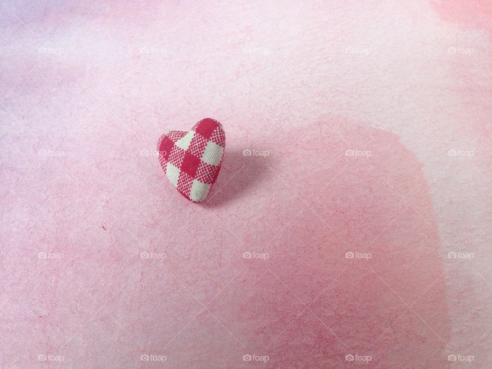 Heart button on watercolor background 