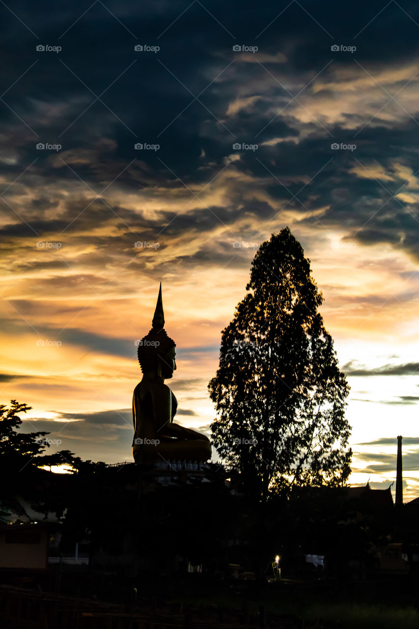 Sunset behind Wat Lad Pha Dook , Temple in Nonthaburi , Thailand.