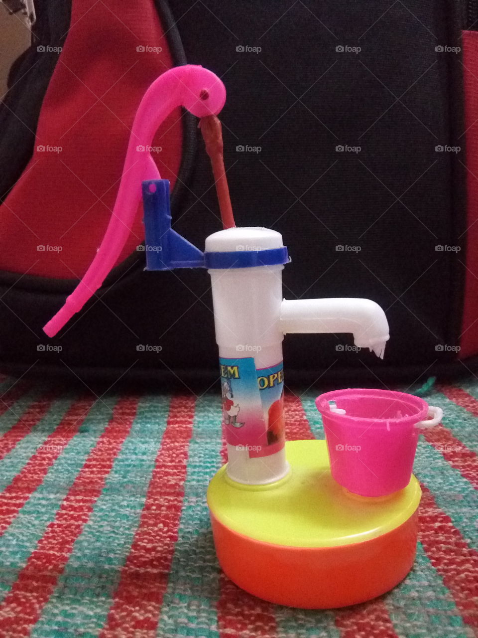 a toy water hand pump- realy working.
