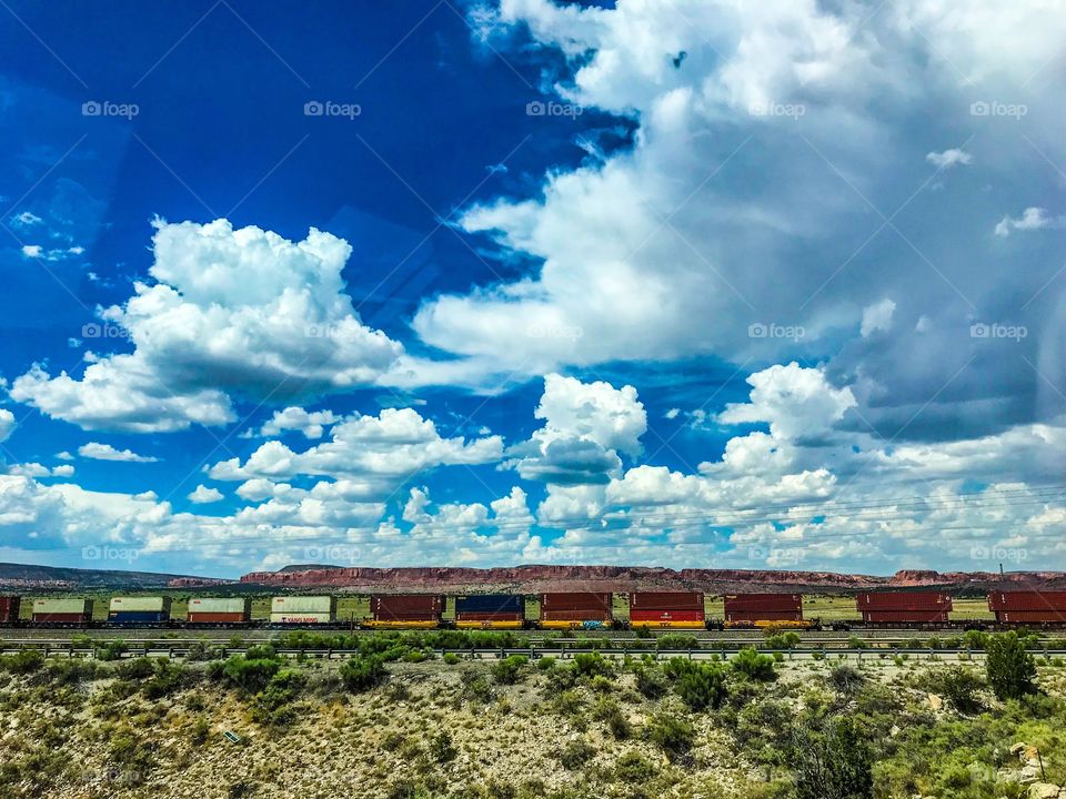 Cargo train in New Mexico with Mesa and Sky in the background