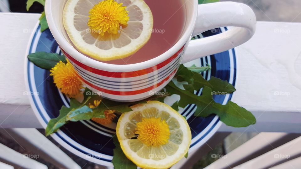 Lemon and flower in tea