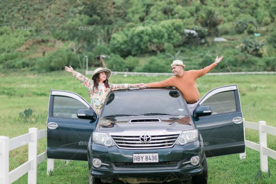 two lovers having a good time with their Toyota car