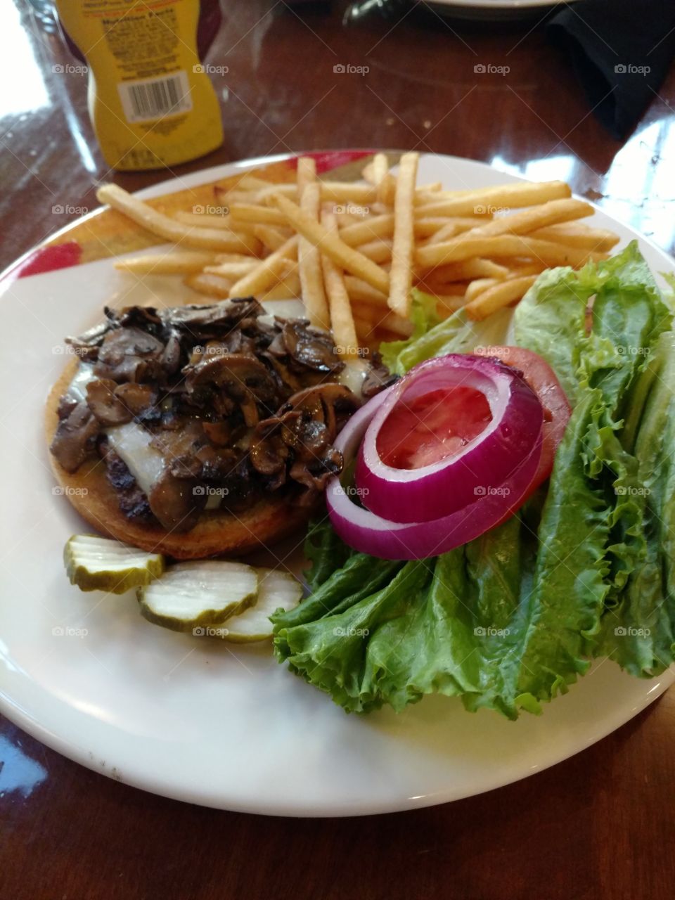 sauteed mushrooms and swiss and french fries