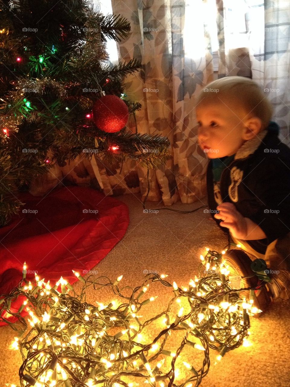 Baby, lights and a tree :)