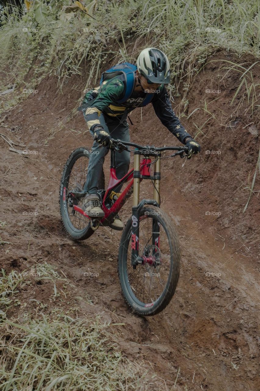 Mountain biker on dirt road