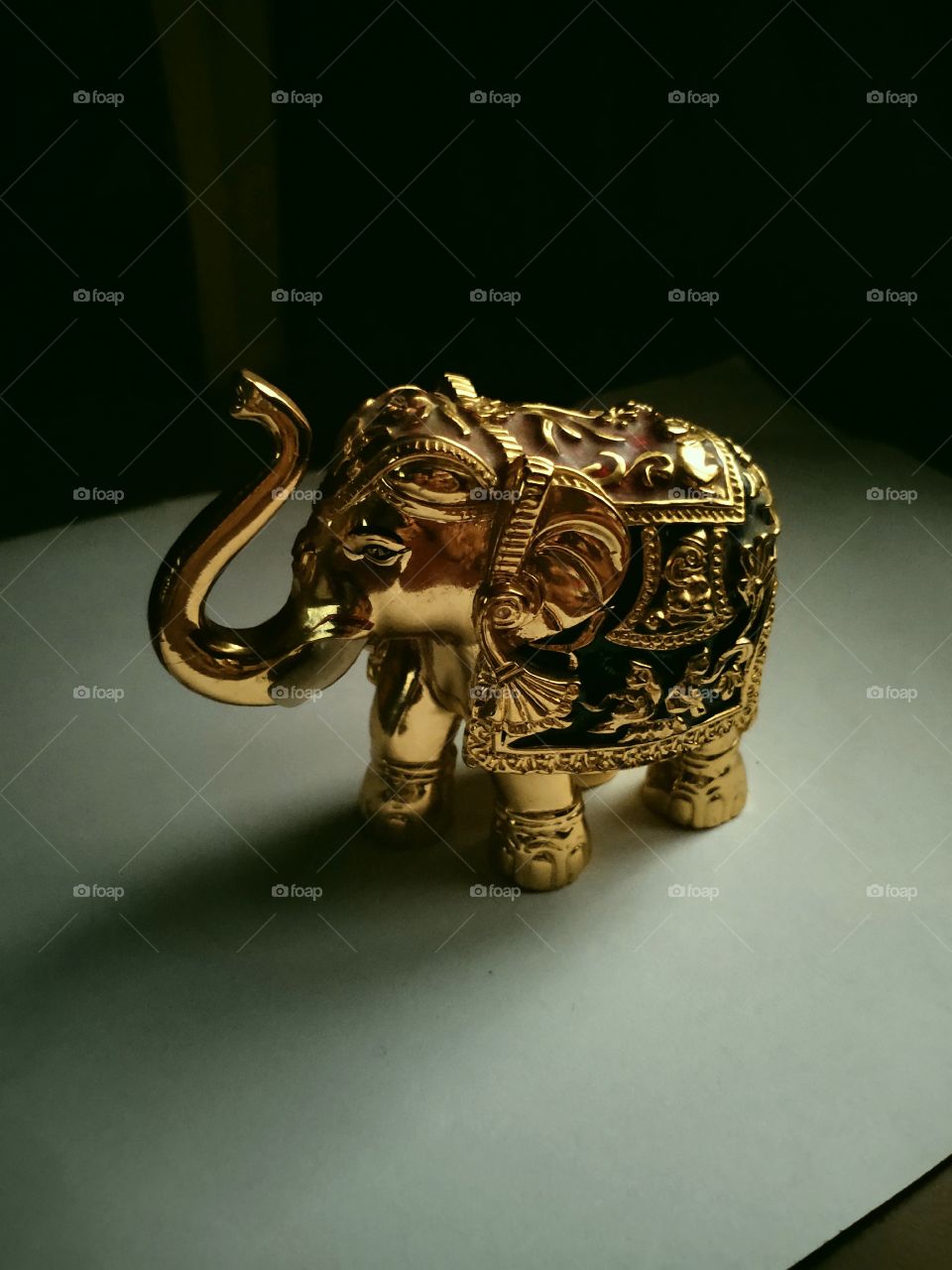 Golden Metal Elephant with Indian Artistic design which looks magnificent and have more royal look due to Gold finishing and artistic work on it, it's an amazing piece of work from Indian artisans.