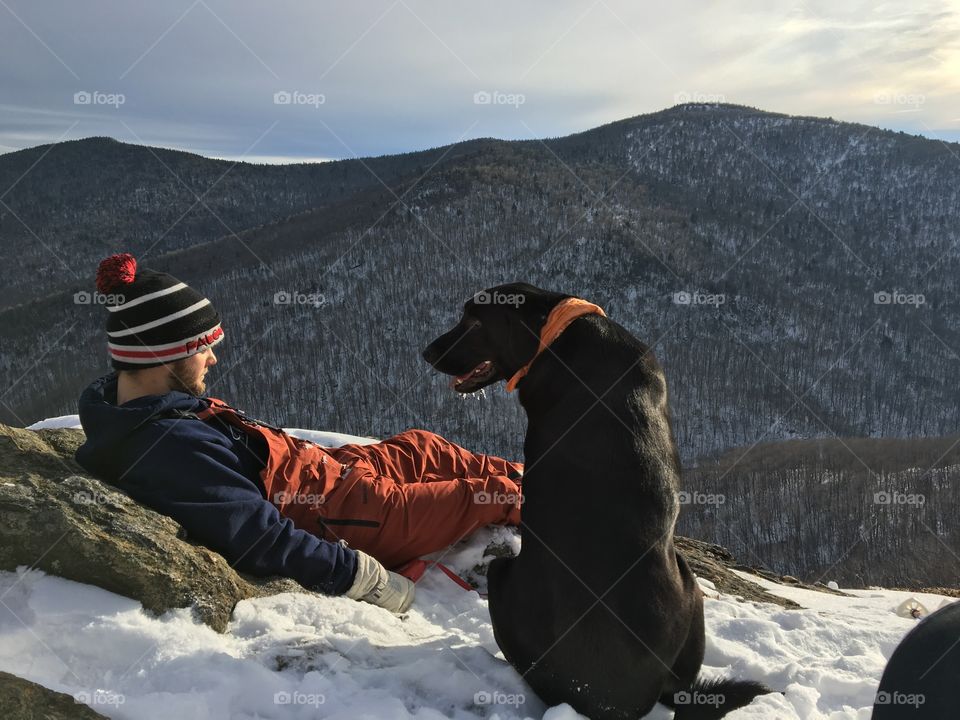 A man, his dog, and the mountains. 