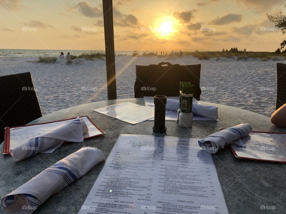 Family of four at The Sandbar for a sunset dinner on Anna Maria Island. We enjoyed an amazing dinner while watching the beautiful sunset with our toes in the sand. Making memories as a family. 