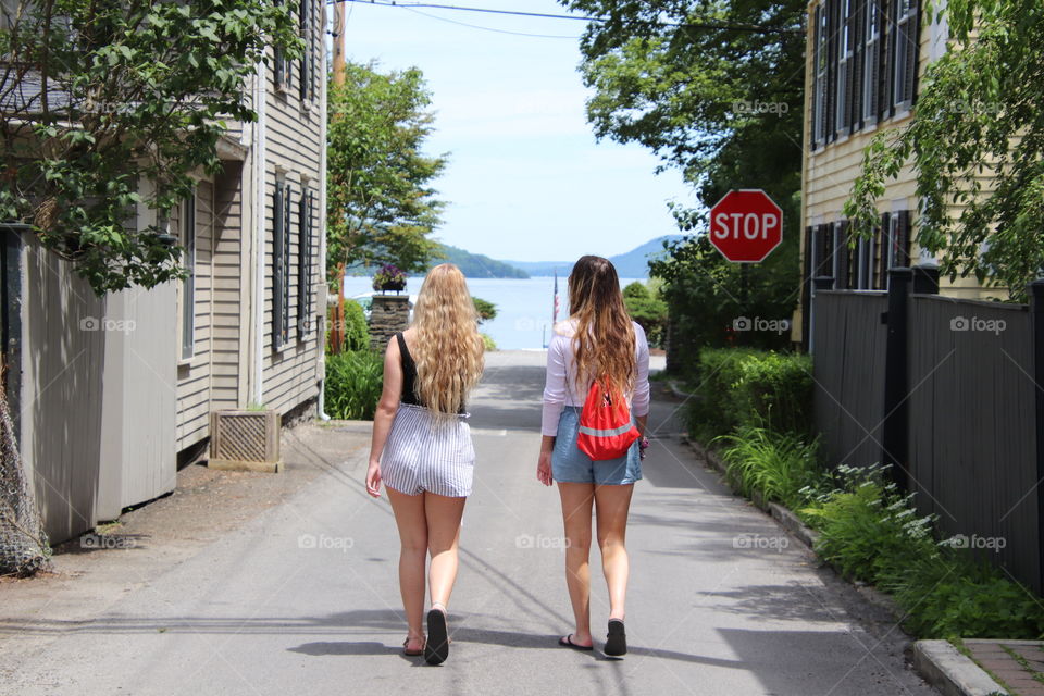 Girls walking on Road located in downtown Cooperstown, NY, USA