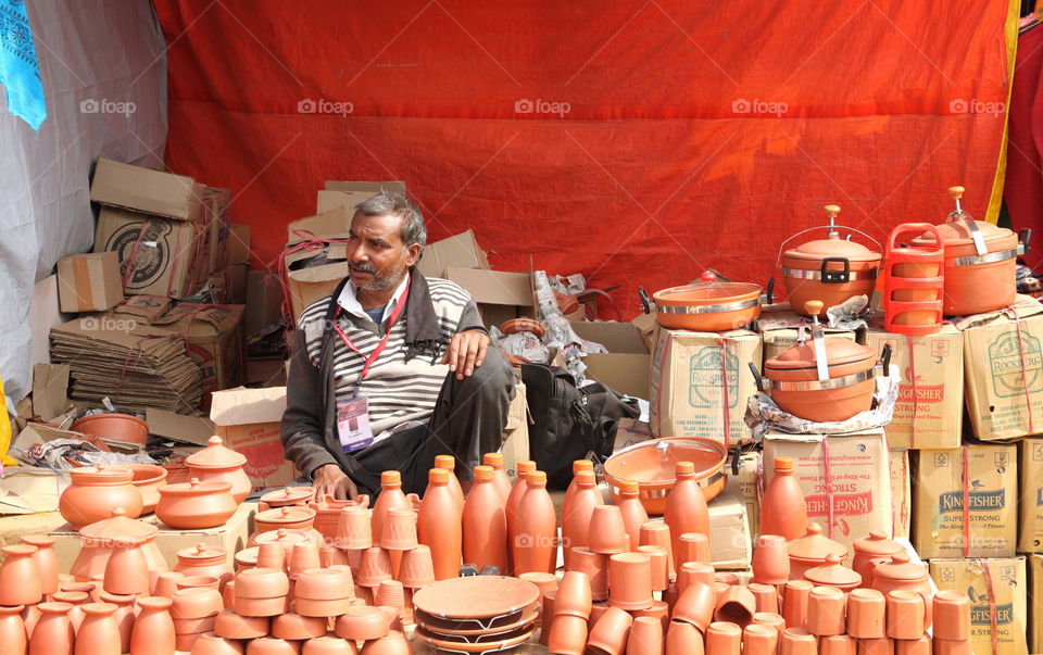 Earthenware seller at surajkund crafts mela in Faridabad, haryana, India