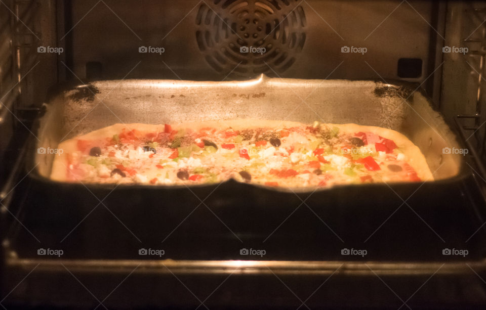 Home Made Pizza Baking In The Oven
