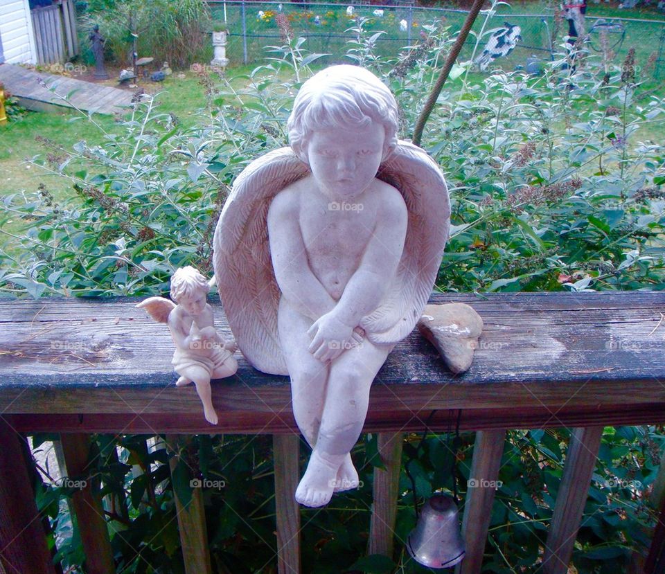 2 Angels Sitting On Porch Rail