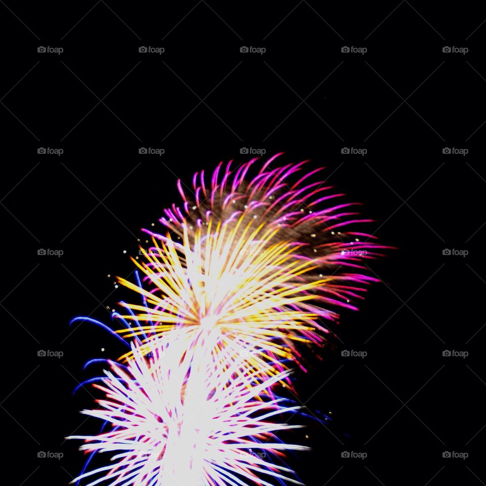 Dazzling purple, yellow, and blue fireworks exploding with color! (Literally!) Makes a nice phone background... 