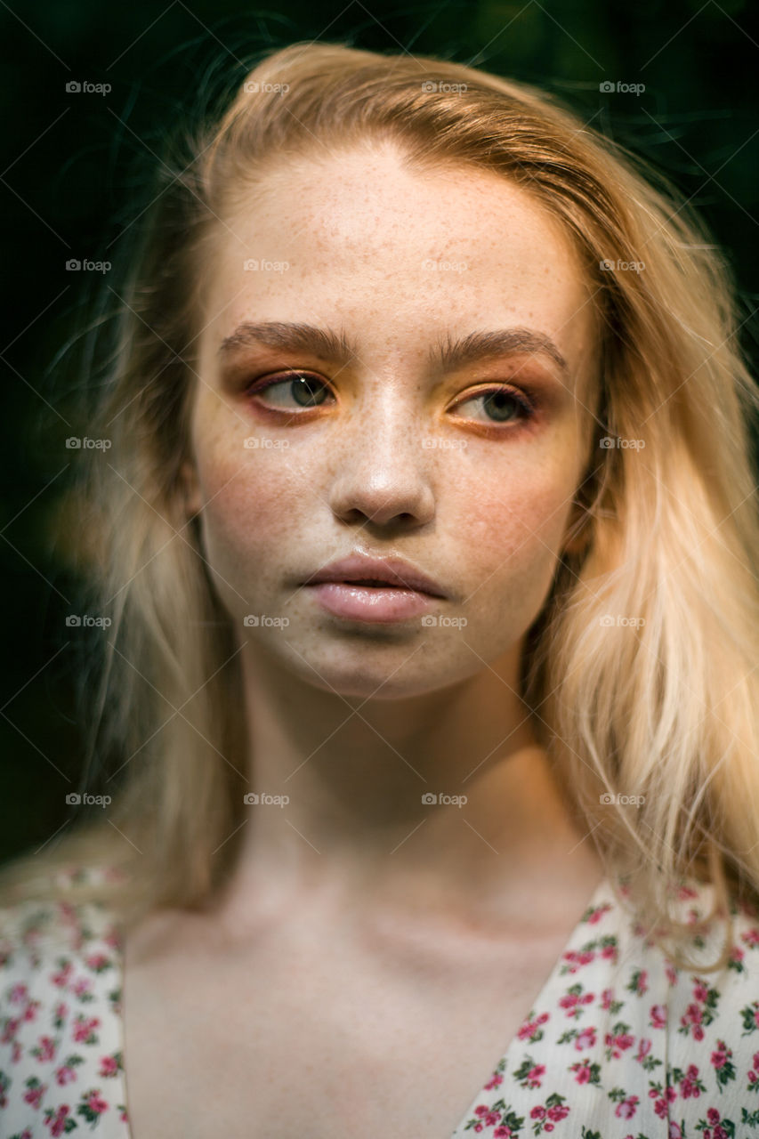 portrait photo of a young woman in nature